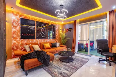 a living room with a couch and a table at Cinéma Pool Unique Experience Mkesh Top10 in Marrakech