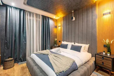 a bedroom with a large bed and a large window at Cinéma Pool Unique Experience Mkesh Top10 in Marrakech