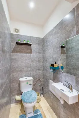 a bathroom with a toilet and a sink at Manahil Modern Apartment Gueliz City Center in Marrakech