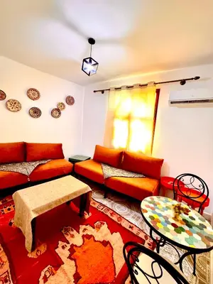 a living room with a couch and a table at Lalla Mama medina house in Marrakech