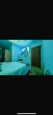 a blue bedroom with a large bed with at Évasion urbain de luxe climatisation fibre in Marrakech