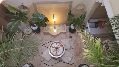 an overhead view of a living room with potted plants at Authentic Riad & Jacuzzi in Marrakech