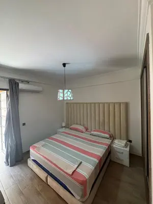 a bedroom with a large bed in a room at Studio au centre ville in Marrakech