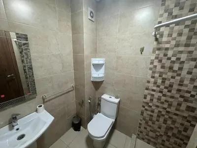 a bathroom with a toilet and a sink at Studio au centre ville in Marrakech