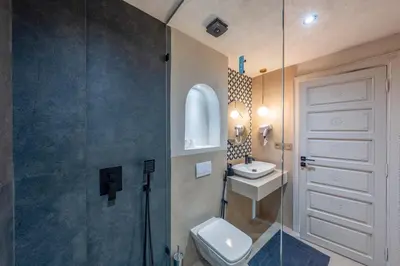 a bathroom with a toilet and a sink and a shower at Pearl of Guéliz Netflix, Terrace, Quiet in Marrakech