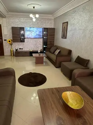 a living room with a couch and a table at Exceptionnel appartement a louer in Marrakech