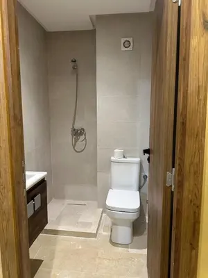 a bathroom with a toilet and a shower at Pool View Quiet et Comfort in Marrakech
