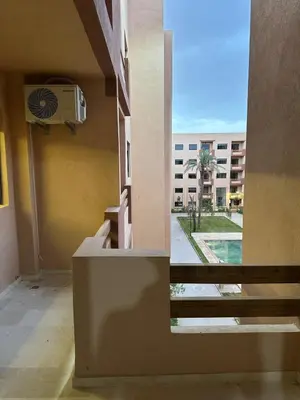 a view from the balcony of a building at Pool View Quiet et Comfort in Marrakech