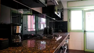 a kitchen with a stove and a counter top at Majorelle Prestige in Marrakech