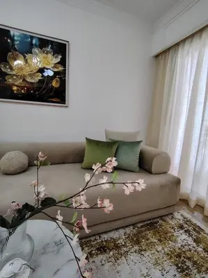 a living room with a couch and a tree at Majorelle Prestige in Marrakech