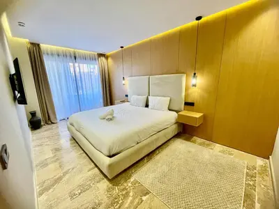 a bedroom with a large white bed in a room at The Gueliz Escape - 2BR Luxury Flat in Marrakech
