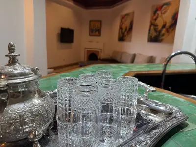 a group of glasses on a tray on a table at Luxury apartement Palmeraie Village in Marrakech