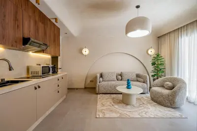 a kitchen and living room with a couch and a table at Modern Haven Guéliz, Netflix, Comfort in Marrakech