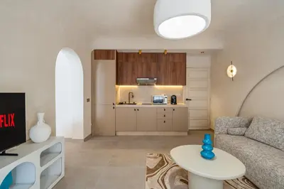 a living room with a couch and a table at Modern Haven Guéliz, Netflix, Comfort in Marrakech