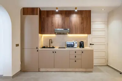 a kitchen with a sink and a microwave at Modern Haven Guéliz, Netflix, Comfort in Marrakech