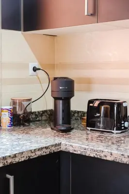 a coffee maker on a counter in a kitchen at Charmant appartement lumineux pres de Gueliz. in Marrakech