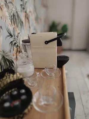 a wooden table with glasses and a box on it at Studio Centre Ville in Marrakech