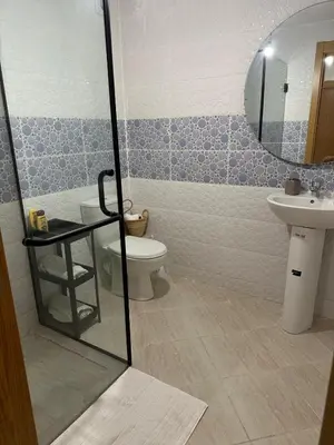 a bathroom with a toilet and a sink at Appartement 2 chambre cosy in Marrakech