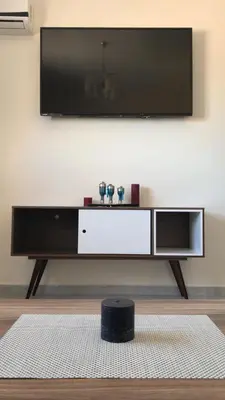 a living room with a flat screen tv on a wall at Chambre équipée à louer Gueliz in Marrakech