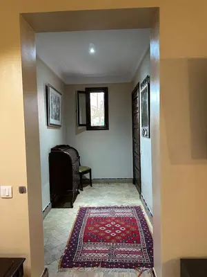a hallway with a door and a rug at Oasis de Charme au coeur de la zone touristique in Marrakech