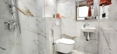 a white bathroom with a toilet and a sink at Marrakech charme urbain à l'hivernage in Marrakech
