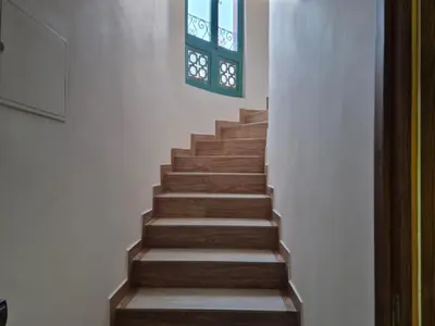 a stairway with wooden steps and a window at Villa Kaina in Marrakech