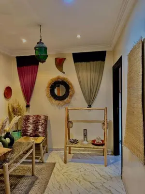 a living room with a couch and a chair at Happy House 2 in Marrakech