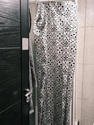 a black and white shower curtain next to a door at Happy House 2 in Marrakech