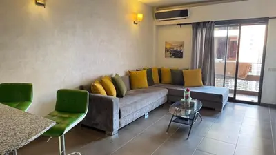 a living room with a couch and a table at Apartment Ghita Cozy Stay in Central Marrakech in Marrakech