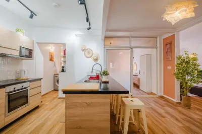 a kitchen with wooden floors and a counter top at Elegant and Confort Moderne au Coeur de la Ville in Marrakech