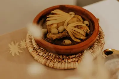 a bowl of food sitting on a table at Riad Dar Melia in Marrakech