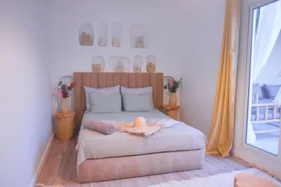 a bedroom with a bed with a hat on it at Villa Elysia Marrakech, Piscine sans vis à vis in Marrakech