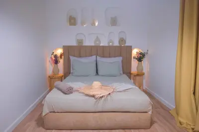 a bedroom with a bed with a hat on it at Villa Elysia Marrakech, Piscine sans vis à vis in Marrakech
