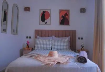a bedroom with a bed with a hat on it at Villa Elysia Marrakech, Piscine sans vis à vis in Marrakech
