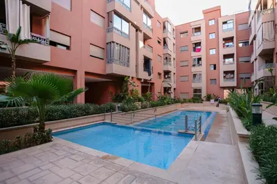 a swimming pool in front of a building at The Smooth Stay Marrakech Pool in Marrakech