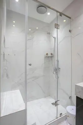 a bathroom with a shower with a glass door at The Smooth Stay Marrakech Pool in Marrakech