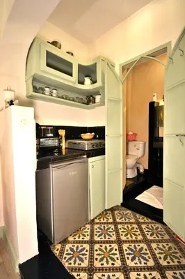 a kitchen with a sink and a dishwasher at Beldi House in Marrakech