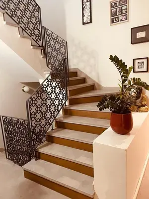 a stairway with a potted plant sitting on a table at Magnifique villa privée piscine 3ch, centre in Marrakech