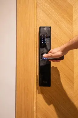 a person unlocking a door with their hand on it at Comfort & Elegance Marrakech in Marrakech