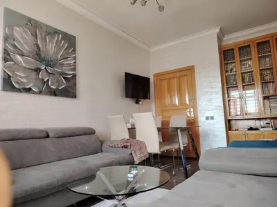 a living room with a couch and a table at Apartment heart of Marrakech in Marrakech