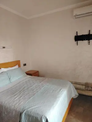 a bedroom with a bed and a lightswitch on the wall at Apartment heart of Marrakech in Marrakech