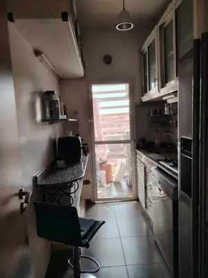 a small kitchen with a counter and a window at Apartment heart of Marrakech in Marrakech
