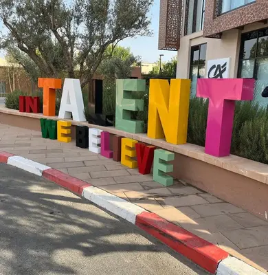 a sign that says a we need to move at M Résidence Marrakech Luxury Serviced Apartments in Marrakech