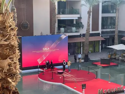 a large screen in a building with people on a red carpet at M Résidence Marrakech Luxury Serviced Apartments in Marrakech