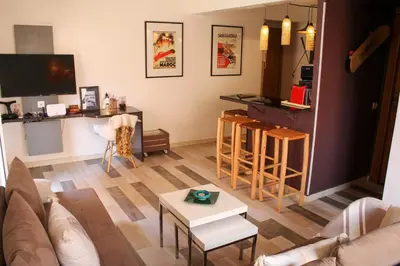 a living room with a couch and a table at VERY RARE APARTMENT GUELIZ CENTER OF Marrakech in Marrakech