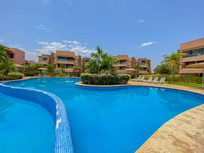 a large blue swimming pool in a resort at Luxury Apartment in Prestigia Marrakech in Marrakech