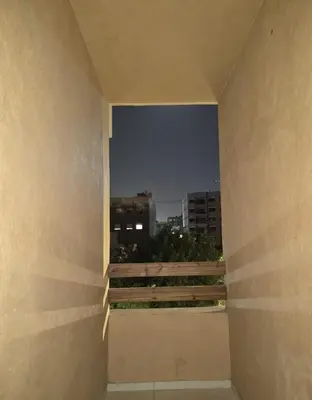 a view of a city skyline through a window at Cozy Family Apartment 2BR Pool Parking Gueliz Marrakesh in Marrakech