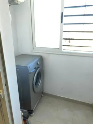 a washing machine in a room with a window at pleasant stay in Marrakesh in Marrakech