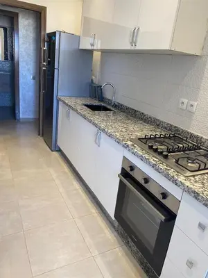 a kitchen with a stove and a refrigerator at pleasant stay in Marrakesh in Marrakech