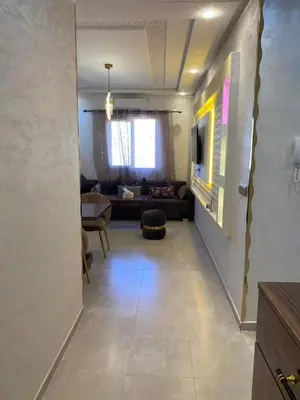 a hallway with a living room with a couch at pleasant stay in Marrakesh in Marrakech